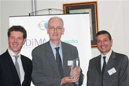 The two presidents of EDiMA and EMOTA present an award to Jean Bergevin, for services to European E-Commerce in 2011 